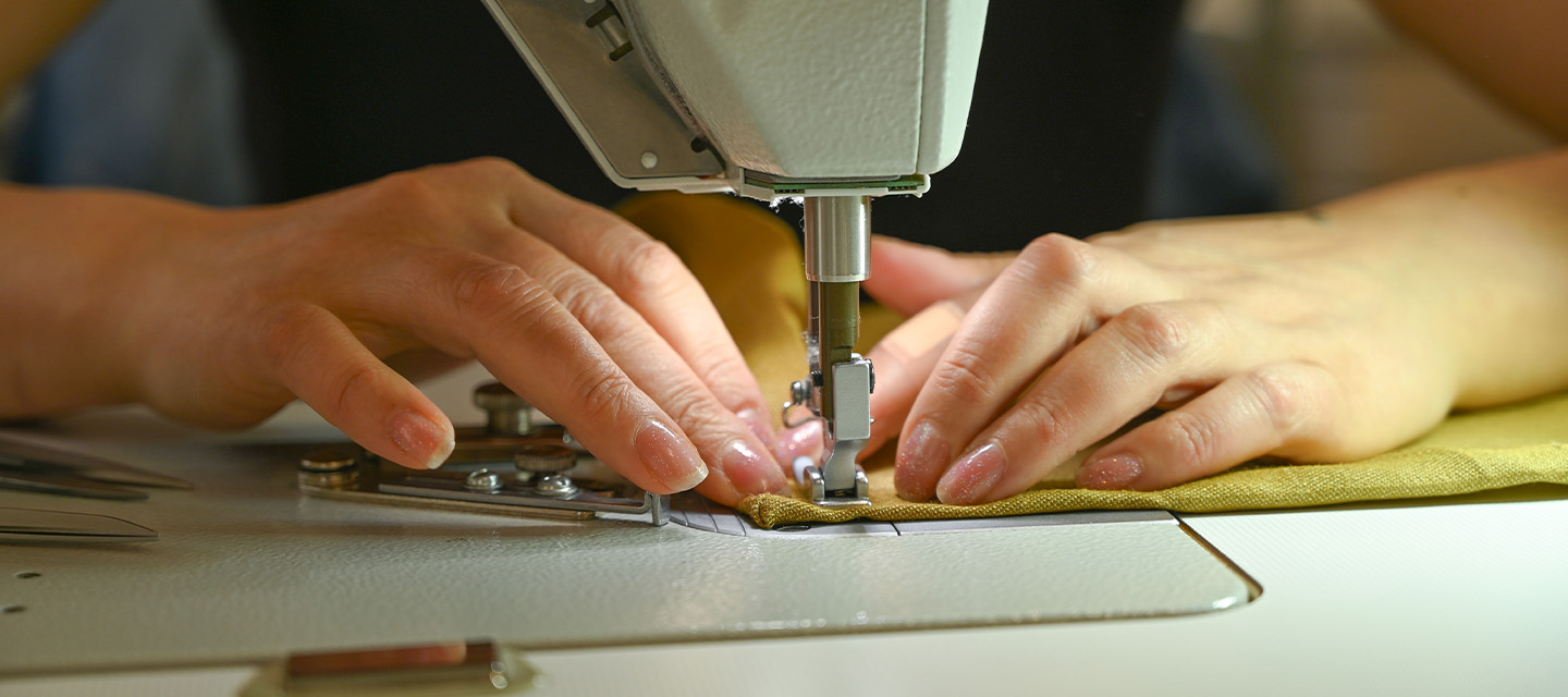 A seamstress's hands at the sewing machine