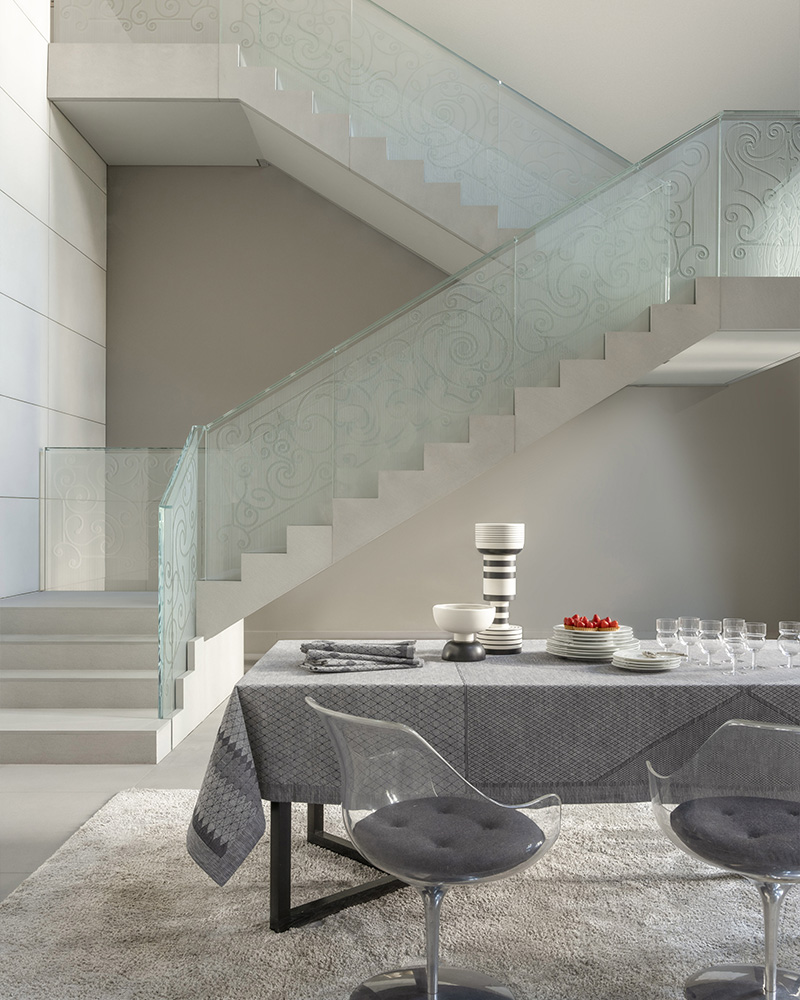 Staircase and set table with a grey tablecloth